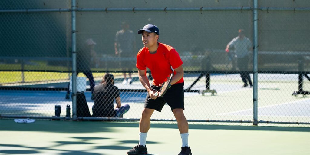 adult-man-playing-tennis
