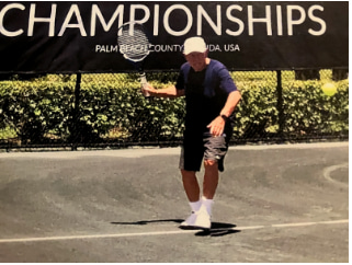 man with tennis racket