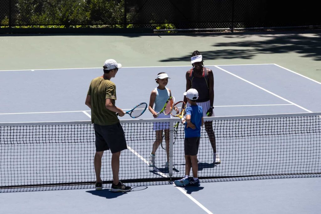 kids-playing-tennis-coaching-session