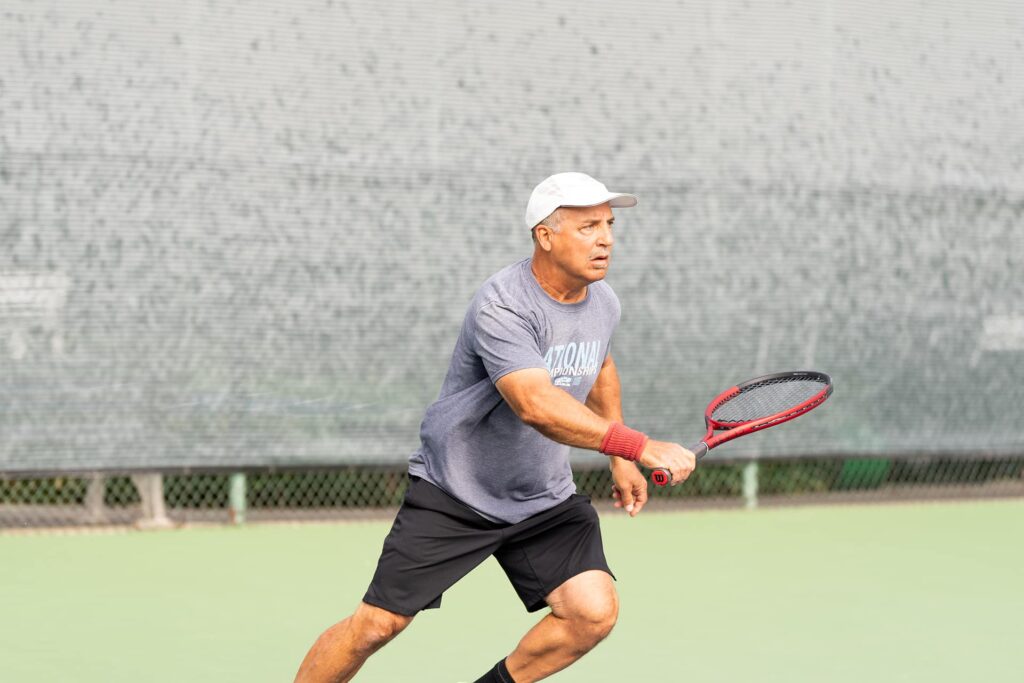 senior tennis player action