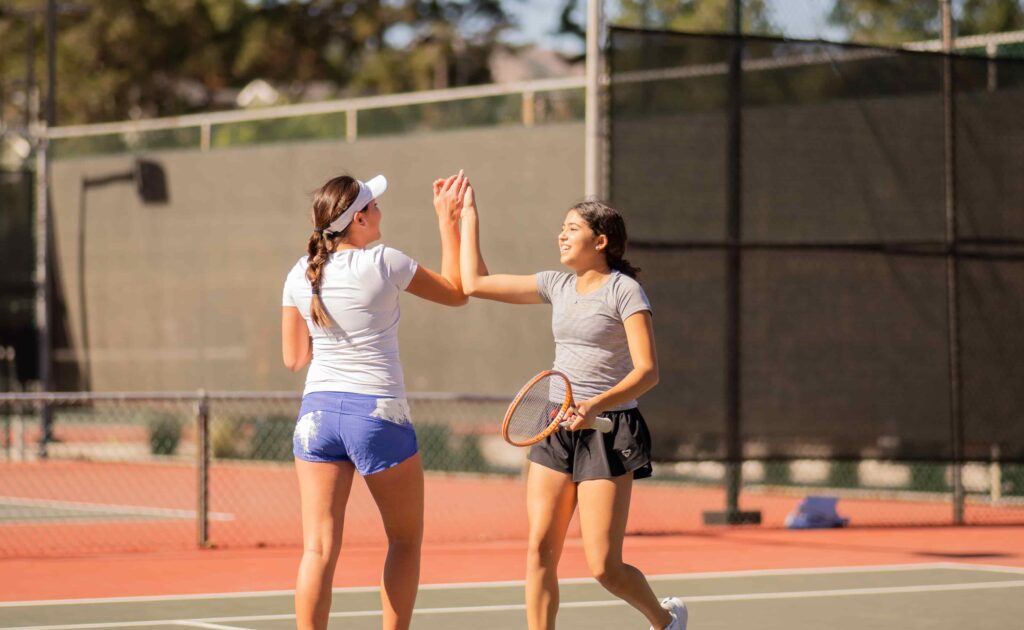 tennis players high five