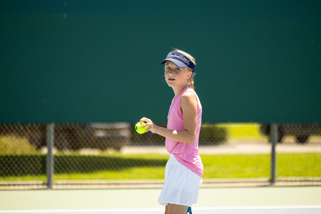 young-tennis-player-holding-ball